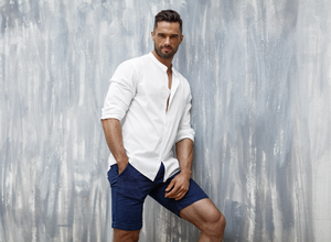 Man wearing shorts with alterations from Tad More Tailoring